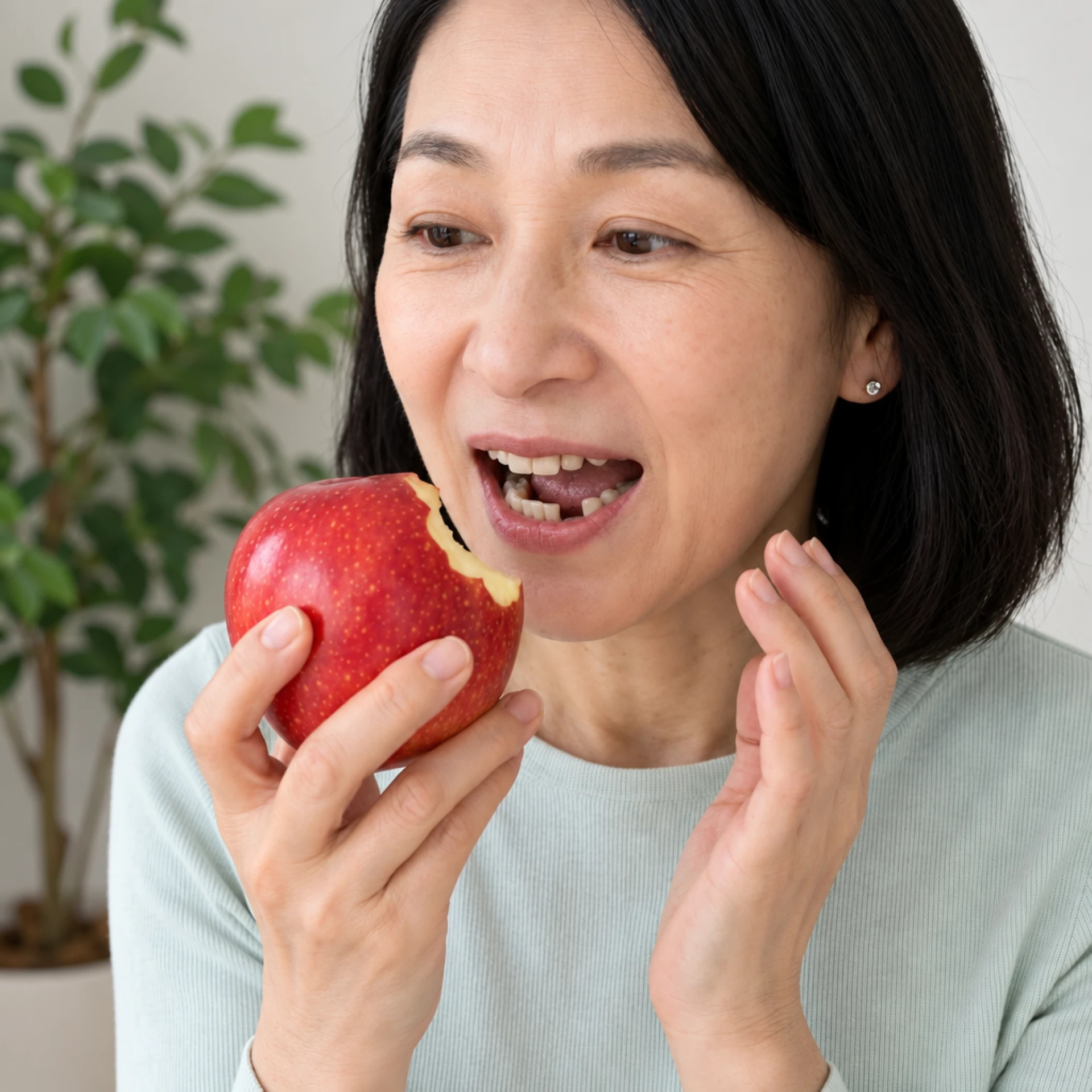 Woman holding her cheek in discomfort from bite changes